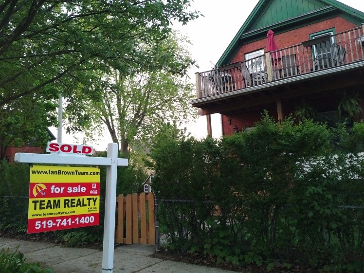 sold sign in midtown kw