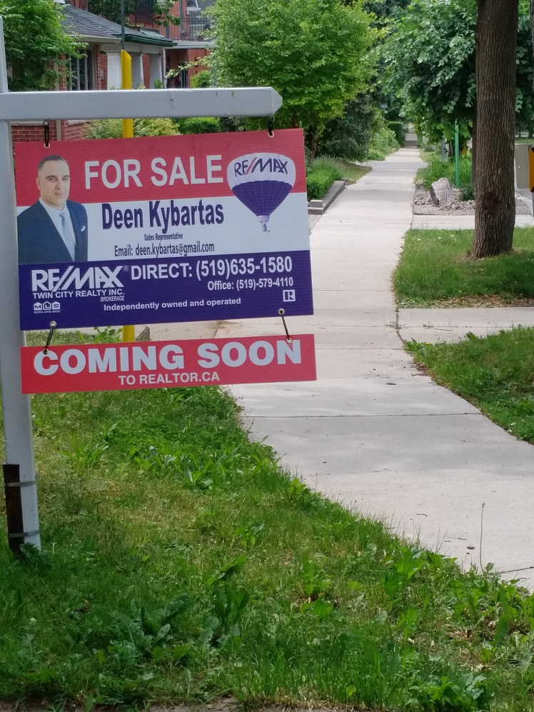 coming soon real estate sign in midtown kw