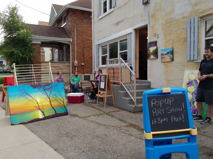 Front yard art show on DeKay Street