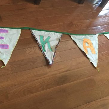 bunting flags spelling out Dekay St.