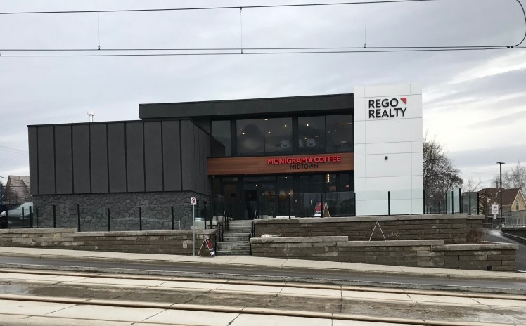 Monigram Midtown has their sign up in MidtownKW