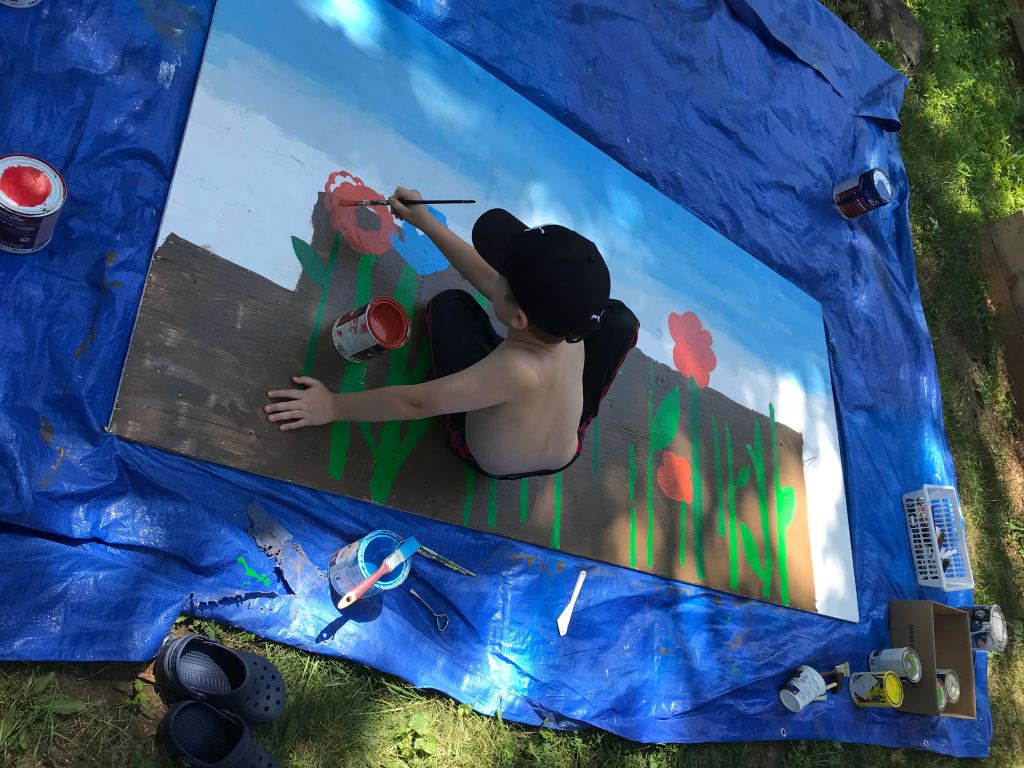 Jon painting his summer garden mural for the Midtown KW neighbourhood art project
